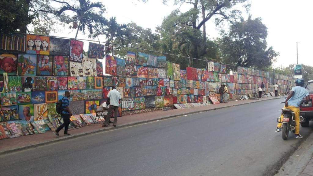 Haitian artworks showcased on a street in Port-au-Prince