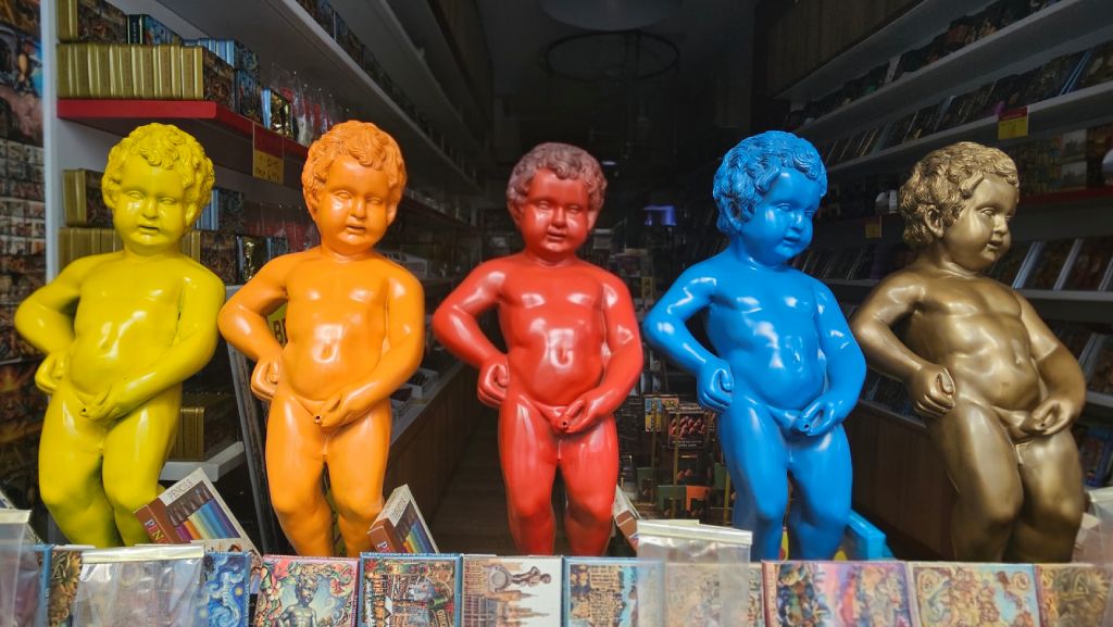 Colorful collection of Manneken Pis statues in Brussels, Belgium