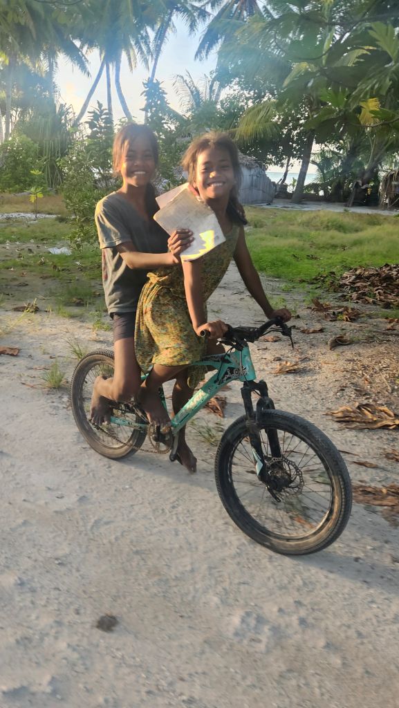 Abaiang_riding_bicycle