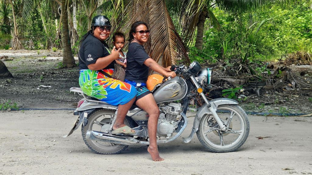Abaiang_riding_a_motorbike