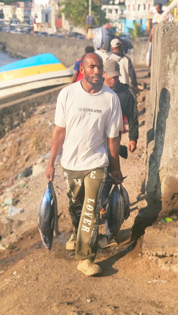 Moroni_man_carrying_fish Comorian man carrying fresh fish in Moroni, Comoros
