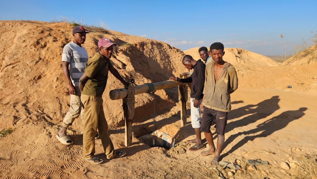 Miners descending into a sapphire mine in Ilakaka, Madagascar