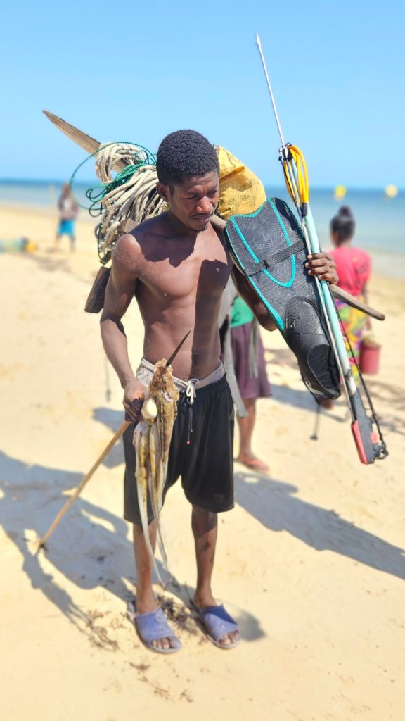 Mangily_fisherman Local fisherman with his catch on Mangily Beach, Madagascar