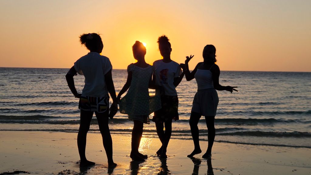 Mangily_girls_sunset Girls posing at sunset on Mangily Beach, Madagascar