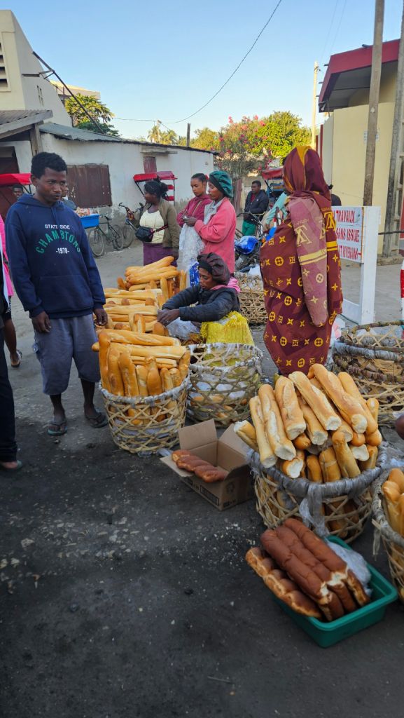 Bread vendor selling baguettes in Toliara, Madagascar