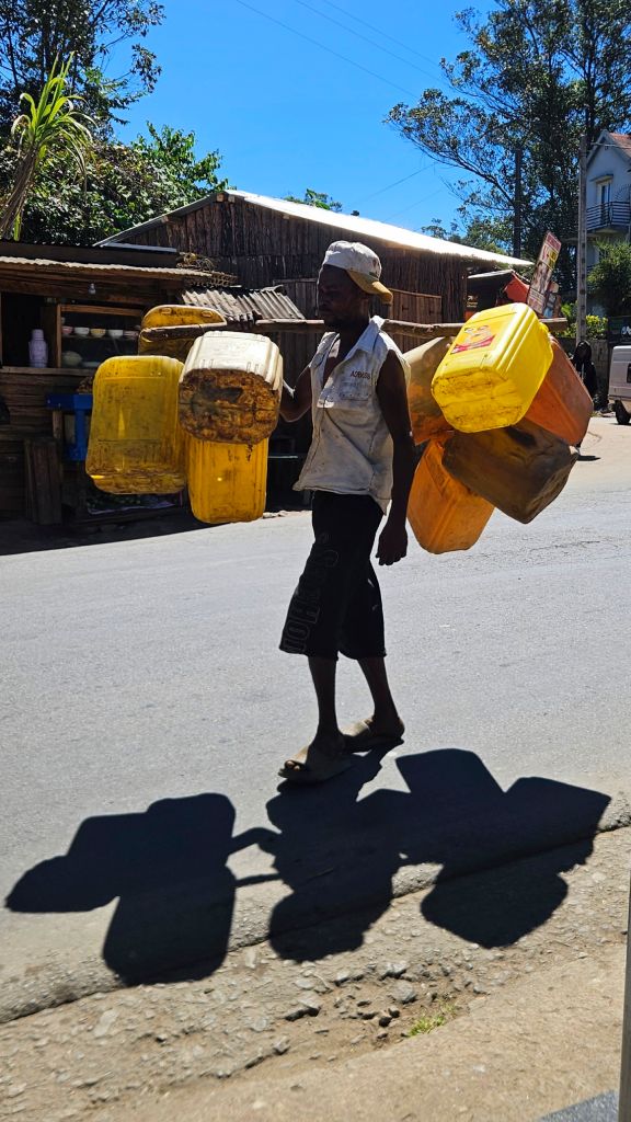Carrying_water_canisters