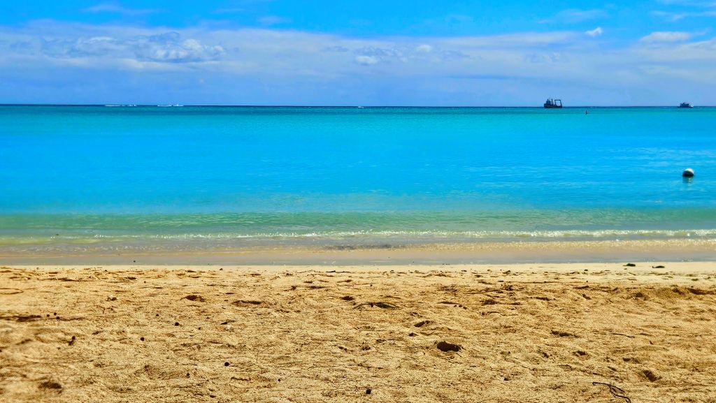 Sandy beach and turquoise lagoon at Mont Choisy, Mauritius